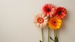 The vibrant blooms sit in a unique vase on a backdrop with only a hint of stem peeking out, Generated by AI