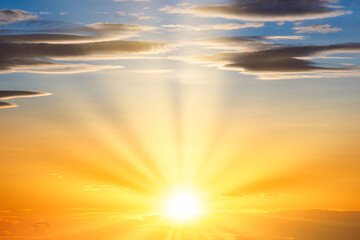 Wall Mural - sunset sky with sun light and sunset clouds background