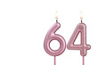 Candle number 64 - Lit birthday candle on white background