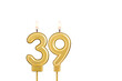 Golden number 39 birthday candle on white background
