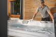Hot Tub Technician Worker Servicing Outdoor SPA