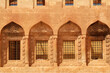 Row of barred windows in ottoman architecture inside of the Ishak Pasha Palace, Sarayi, Dogubeyazit, Turkey