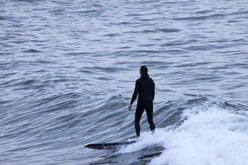 Poster - Surfer riding the ocean waves