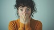© Олег Фадеев - Portrait of scared young woman covering her mouth with her hands