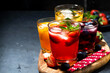cold fruit and berry beverages in assortment on dark table