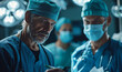 Focused senior surgeons in blue scrubs discussing patient's medical chart in operating room