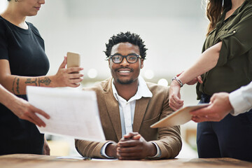 Fototapete - Business man, chaos and colleagues in portrait with documents for crisis in workplace or calm in stress. Male person, coworkers and smile with papers for teamwork, mentorship or leadership in office