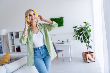 Wall Mural - Photo of positive adorable good mood girl listening modern energetic music playlist enjoying harmony cosy time indoors