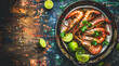 A plate of shrimp and lime is on a table. The plate is placed on a wooden table with a colorful background. Generative AI