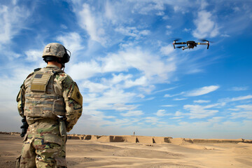 A soldier controls a drone