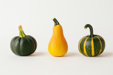 Wall Mural - three pumpkins on a white background