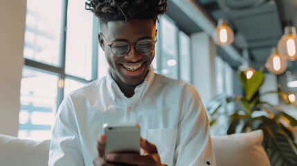 Wall Mural - Smiling Man Using Smartphone