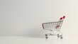 Minimalist design featuring a shopping cart on a plain white background