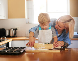 baking, mother and boy child with dough in kitchen for teaching, learning or development in home. re
