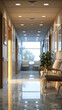 Sunlit office corridor featuring a comfortable waiting area, reflective marble floors, and framed wall art.