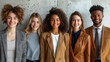 a group of cheerful people of different nationalities in business style clothes on a grey background 