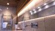 A modern bathroom featuring close-up, high-res lighting design, highlighting a row of LED lights that provide a clean and energy-efficient illumination
