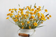 bouquet of wildflowers, yellow daisies in a can, close-up. summer background.