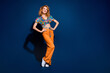 © deagreez - Full size photo of pretty young woman posing look empty space wear top isolated on dark blue color background