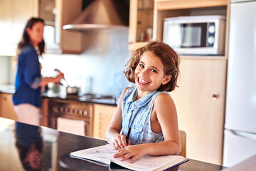 Poster - Child, homework and portrait of girl in home for education, learning or working on school assessment in kitchen. Smile, student and young kid with notebook for knowledge, development or writing