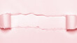 真ん中が破れてめくれているピンク色の紙 -コピースペースのあるシンプルでかわいい背景素材 - 16:9