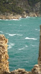 Wall Mural - Slow motion, panoramic view to the cliffs and the Mediterranean sea in the sunny morning.