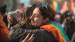 © Nati - A defiant gesture depicted as a couple of women hug boldly at the rally, their embrace a symbol of resistance against discrimination and prejudice, as they demand equal rights and