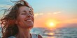 © Ace64 Studio - Happy 40 year old woman on the beach smiling with serenity