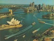 Panoramic aerial shot of Sydney Harbour, featuring iconic landmarks and bustling water traffic.