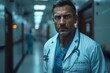 © Vladimir - A doctor with a stethoscope is standing in a hospital hallway