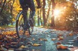 person riding a bicycle in autumn park