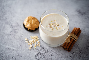 Wall Mural - Peanut butter banana smoothie in a glass