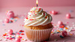 Pink birthday cupcake. Tasty cupcake with candle on pink background
