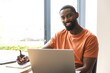 © Wavebreak Media - At home, African American male homeowner working on laptop at a desk