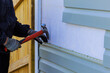 © ungvar - Replacing plastic siding on an exterior wall of residence house