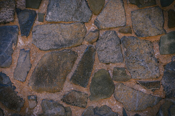 Poster - Granite stones of different shapes and colors. Wall cladding. 1