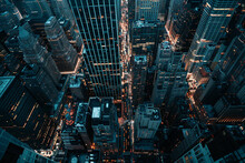 A Panoramic View Of A Bustling Metropolis From The Top Of A Skyscraper At Twilight.