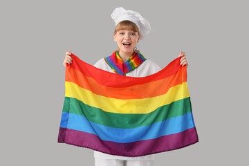 Wall Mural - Female chef with LGBT flag on light background