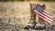 © woret - American flag in military boots on ground