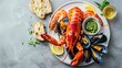 Big red lobster on plate with shrimp and mussels with lemon, souce pesto and bread. Seafood concept.