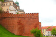 The old red brick Zamek Krolewski na Wawelu castle in the center of Krakow.