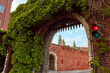 An old vintage metal gate with an archway to the old Zamek Krolewski na Wawelu castle in the center of Krakow.