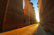 Golden morning sunlight fills the central passage of the Great Temple of Karnak illuminating majestic hypostyle columns at the Karnak temple complex dedicated to Amun-Re in Luxor,Egypt