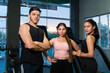 Portrait Group of three confident, fit young indian friends workout together in gym. athletes, fitness, sports, healthy lifestyle.
