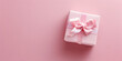 Gift boxes and ribbon on pink background, Pink gift box with a pink bow on the top.

