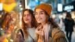 © aekkorn - Three girls window shopping together.