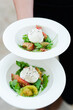 Elegant caprese salad with fresh mozzarella and vibrant greens