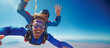 A man is skydiving with his instructor. They are both smiling an