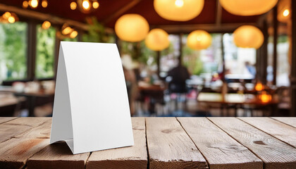 Aufkleber - Three-Dimensional Blank Table Tent Mockup for Eatery Menu, blurred restaurant background