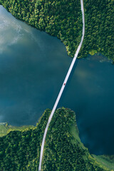 Poster - Aerial view of bridge asphalt road with cars and blue water lake and green woods